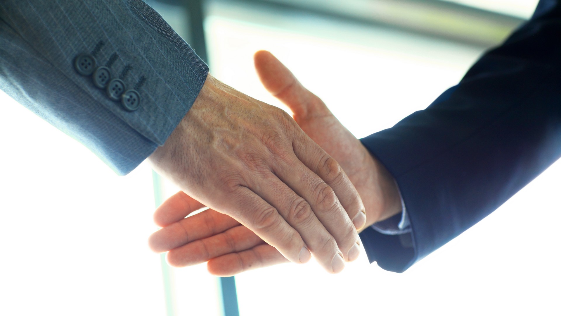 Business people shaking hands, finishing up a meeting